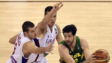 Brazil's forward Guilherme Giovannoni (R) vies with Serbia's forward Nemanja Bjelica (C) and Serbia's guard Bogdan Bogdanovic during the 2014 FIBA World basketball championships group A match Serbia vs Brazil at the Palacio Municipal de Deportes in Granada on September 3, 2014. AFP PHOTO/ JAVIER SORIANO (Photo credit should read JAVIER SORIANO/AFP via Getty Images)