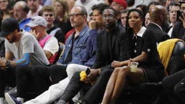 Former Miami Heat player Dwyane Wade and wife, Gabrielle Union look on during the first half between the Miami Heat and the Cleveland Cavaliers at American Airlines Arena (Photo by Michael Reaves/Getty Images)