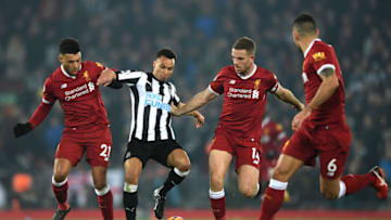 LIVERPOOL, ENGLAND - MARCH 03: Jacob Murphy of Newcastle United is chased by Jordan Henderson and Alex Oxlade-Chamberlain of Liverpool during the Premier League match between Liverpool and Newcastle United at Anfield on March 3, 2018 in Liverpool, England. (Photo by Gareth Copley/Getty Images)