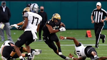 Ryan Yaites, Texas Football. Abilene High running back Phonzo Dotson steps around Denton Guyer center back Ryan Yaites during Saturday's Region I-6A D-II semifinal football game at Globe Life Park in Arlington Dec. 26, 2020. Final score was 38-21, Denton Guyer.