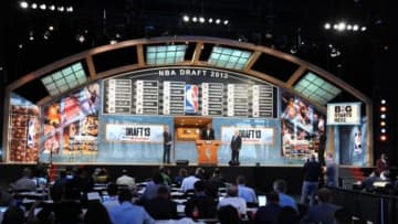 Jun 27, 2013; Brooklyn, NY, USA; A general view as NBA commissioner David Stern (right) , deputy commissioner Adam Silver (left) and former NBA player Hakeem Olajuwon speak on stage after the first round of the 2013 NBA Draft at the Barclays Center. Mandatory Credit: Joe Camporeale-USA TODAY Sports