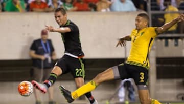 Jul 26, 2015; Philadelphia, PA, USA; Mexico defender Paul Aguilar (22) shoots past Jamaica defender Michael Hector (3) during the CONCACAF Gold Cup final match at Lincoln Financial Field. Mexico won 3-1. Mandatory Credit: Bill Streicher-USA TODAY Sports