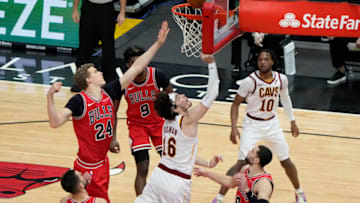 Mar 24, 2021; Chicago, Illinois, USA; Cleveland Cavaliers forward Cedi Osman (16) shoots the ball against Chicago Bulls forward Lauri Markkanen (24) during the second half at the United Center. Mandatory Credit: Mike Dinovo-USA TODAY Sports