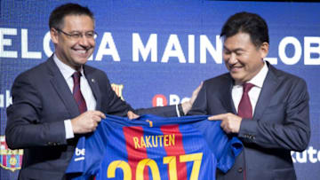 BARCELONA, SPAIN - NOVEMBER 16: Hiroshi Mikitani, CEO of Rakuten Inc., and FC Barcelona's president Josep Maria Bartomeu pose with a FC Barcelona jersey after signing an agreement between FC Barcelona and Rakuten Inc., at Camp Nou stadium in Barcelona on November 16, 2016. Japanese online retailer Rakuten will be Barcelona's main sponsor for the next four years. Rakuten will replace Qatar Airways which has been Barcelona's shirt sponsor since 2013. (Photo by Albert Llop/Anadolu Agency/Getty Images)