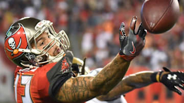 Dec 11, 2016; Tampa, FL, USA; Tampa Bay Buccaneers wide receiver Mike Evans (13) drops a pass in the second half against the New Orleans Saints at Raymond James Stadium. The Tampa Bay Buccaneers defeated the New Orleans Saints 16-11. Mandatory Credit: Jonathan Dyer-USA TODAY Sports