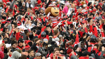 Nov 26, 2016; Columbus, OH, USA; Brutus Buckeye crowd surfs as fans surge onto the field following the win over the Michigan Wolverines at Ohio Stadium. Ohio State won 30-27. Mandatory Credit: Joe Maiorana-USA TODAY Sports
