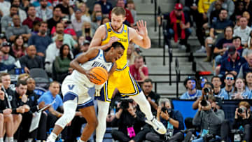 Mar 24, 2022; San Antonio, TX, USA; Villanova Wildcats forward Brandon Slater (3) drives to the basket against Michigan Wolverines center Hunter Dickinson (1) in the semifinals of the South regional of the men's college basketball NCAA Tournament at AT&T Center. Mandatory Credit: Daniel Dunn-USA TODAY Sports