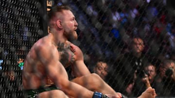 Jul 10, 2021; Las Vegas, Nevada, USA; Conor McGregor holds his leg after suffering an injury against Dustin Poirier during UFC 264 at T-Mobile Arena. Mandatory Credit: Gary A. Vasquez-USA TODAY Sports