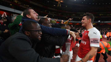LONDON, ENGLAND - NOVEMBER 03: Granit Xhaka celebrates the Arsenal goal with the fans during the Premier League match between Arsenal FC and Liverpool FC at Emirates Stadium on November 3, 2018 in London, United Kingdom. (Photo by Stuart MacFarlane/Arsenal FC via Getty Images)