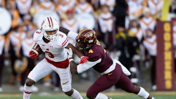 MINNEAPOLIS, MN - NOVEMBER 25: Adekunle Ayinde #4 of the Minnesota Golden Gophers tackles Kendric Pryor #3 of the Wisconsin Badgers during the first quarter of the game on November 25, 2017 at TCF Bank Stadium in Minneapolis, Minnesota. (Photo by Hannah Foslien/Getty Images)
