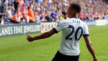 Tottenham Hotspur's English midfielder Dele Alli celebrates scoring the opening goal of the English Premier League football match between Leicester City and Tottenham Hotspur at King Power Stadium in Leicester, central England on August 22, 2015. The game finished 1-1. AFP PHOTO / GEOFF CADDICK RESTRICTED TO EDITORIAL USE. No use with unauthorized audio, video, data, fixture lists, club/league logos or 'live' services. Online in-match use limited to 75 images, no video emulation. No use in betting, games or single club/league/player publications. (Photo credit should read GEOFF CADDICK/AFP/Getty Images)