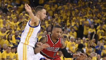May 11, 2016; Oakland, CA, USA; Portland Trail Blazers guard Damian Lillard (0) dribbles the basketball against Golden State Warriors guard Stephen Curry (30) during the second quarter in game five of the second round of the NBA Playoffs at Oracle Arena. Mandatory Credit: Kyle Terada-USA TODAY Sports