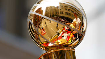 DENVER, CO - JUNE 15: Nikola Jokic #15 is reflected in the Larry O'Brien Championship Trophy during the Denver Nuggets victory parade and rally after winning the 2023 NBA Championship on June 15, 2023 in Denver, Colorado. NOTE TO USER: User expressly acknowledges and agrees that, by downloading and or using this photograph, User is consenting to the terms and conditions of the Getty Images License Agreement. (Photo by Justin Edmonds/Getty Images)