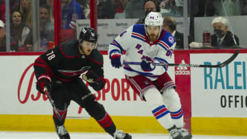 May 20, 2022; Raleigh, North Carolina, USA; New York Rangers center Tyler Motte (64) and Carolina Hurricanes center Steven Lorentz (78) watch the puck during the first period in game two of the second round of the 2022 Stanley Cup Playoffs at PNC Arena. Mandatory Credit: James Guillory-USA TODAY Sports