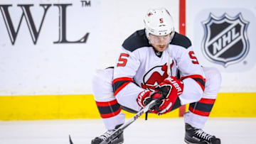 Nov 17, 2015; Calgary, Alberta, CAN; New Jersey Devils defenseman Adam Larsson (5) during the warmup period against the Calgary Flames at Scotiabank Saddledome. Calgary Flames won 3-2. Mandatory Credit: Sergei Belski-USA TODAY Sports