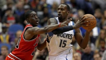 Nov 1, 2014; Minneapolis, MN, USA; Minnesota Timberwolves forward Shabazz Muhammad (15) attempts to pass around Chicago Bulls forward Tony Snell (20) during the second quarter at Target Center. Mandatory Credit: Brace Hemmelgarn-USA TODAY Sports