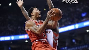 Nov 13, 2014; Toronto, Ontario, CAN; Chicago Bulls guard Derrick Rose (1) jumps to score against the Toronto Raptors during the first period at Air Canada Centre. Mandatory Credit: Peter Llewellyn-USA TODAY Sports