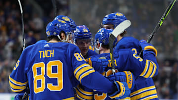 Jan 10, 2023; Buffalo, New York, USA; Buffalo Sabres defenseman Rasmus Dahlin (26) celebrates his goal with teammates during the second period against the Seattle Kraken at KeyBank Center. Mandatory Credit: Timothy T. Ludwig-USA TODAY Sports