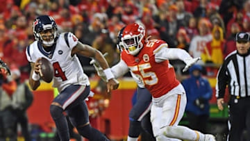 KANSAS CITY, MISSOURI - JANUARY 12: Quarterback Deshaun Watson #4 of the Houston Texans scrambles away form defensive end Frank Clark #55 of the Kansas City Chiefs in the second half during the AFC Divisional playoff game at Arrowhead Stadium on January 12, 2020 in Kansas City, Missouri. (Photo by Peter G. Aiken/Getty Images)