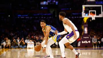 LOS ANGELES, CALIFORNIA - MAY 06: Jordan Poole #3 of the Golden State Warriors and Troy Brown Jr. #7 of the Los Angeles Lakers during game three of the Western Conference Semifinal Playoffs at Crypto.com Arena on May 06, 2023 in Los Angeles, California. NOTE TO USER: User expressly acknowledges and agrees that, by downloading and/or using this photograph, user is consenting to the terms and conditions of the Getty Images License Agreement. (Photo by Ronald Martinez/Getty Images)