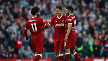 LIVERPOOL, ENGLAND - APRIL 14: Roberto Firmino of Liverpool celebrates after scoring his sides third goal with Mohamed Salah ofLiverpool and Alex Oxlade-Chamberlain of Liverpool during the Premier League match between Liverpool and AFC Bournemouth at Anfield on April 14, 2018 in Liverpool, England. (Photo by Clive Brunskill/Getty Images)