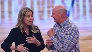 LOS ANGELES, CA - FEBRUARY 18: Los Angeles Lakers owner Jeannie Buss and Los Angeles Clippers owner Steve Ballmer wait to hand off the ball to former NBA player and Charlotte Hornets owner Michael Jordan during the unveiling of the 2019 NBA All-Star game logo and city, being hosted in Charlotte, North Carolina next year, during the 2018 NBA All-Star Game at the Staples Center in Los Angeles, California on February 18, 2018 (Photo by Jayne Kamin-Oncea/Getty Images)
