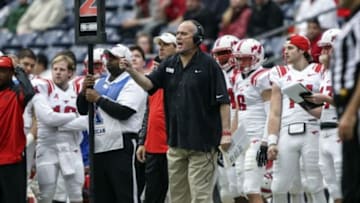 Nov 29, 2013; Houston, TX, USA; Southern Methodist Mustangs head coach June Jones shouts from the sideline during the second quarter against the Houston Cougars at Reliant Stadium. Mandatory Credit: Troy Taormina-USA TODAY Sports
