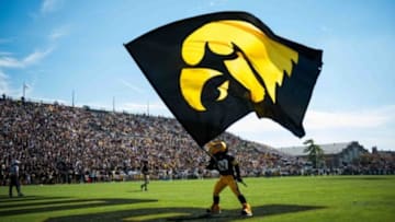 Sep 27, 2014; West Lafayette, IN, USA; The Iowa Hawkeyes mascot waves the Iowa flag in the end zone after a touchdown against the Purdue Boilermakers during the second half of the game at Ross Ade Stadium . The Iowa Hawkeyes beat the Purdue Boilermakers 24 to 10. Mandatory Credit: Marc Lebryk-USA TODAY Sports
