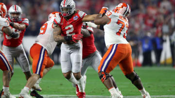 GLENDALE, ARIZONA - DECEMBER 28: Chase Young #2 of the Ohio State Buckeyes runs past Tremayne Anchrum #73 of the Clemson Tigers in the first half during the College Football Playoff Semifinal at the PlayStation Fiesta Bowl at State Farm Stadium on December 28, 2019 in Glendale, Arizona. (Photo by Matthew Stockman/Getty Images)
