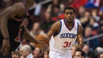 Mar 19, 2014; Philadelphia, PA, USA; Philadelphia 76ers forward Hollis Thompson (31) brings the ball up court during the third quarter against the Chicago Bulls at the Wells Fargo Center. The Bulls defeated the Sixers 102-94. Mandatory Credit: Howard Smith-USA TODAY Sports