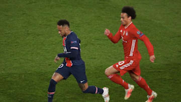 PSG forward Neymar Jr in action against Bayern Munich forward Leroy Sane in 2021. (Photo by Xavier Laine/Getty Images)