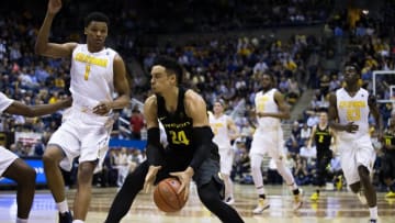Feb 11, 2016; Berkeley, CA, USA; Oregon Ducks forward Dillon Brooks (24) controls the ball against California Golden Bears forward Ivan Rabb (1) during the second half at Haas Pavilion. The California Golden Bears defeated the Oregon Ducks 83-63. Mandatory Credit: Kelley L Cox-USA TODAY Sports