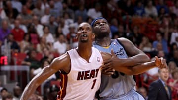 Miami Heat forward Chris Bosh (1) and Memphis Grizzlies forward Zach Randolph battle for position under the basket during the second quarter at the AmericanAirlines Arena in Miami, Friday, March 21, 2014. The Heat beat the Grizzlies, 91-86. (David Santiago/El Nuevo Herald/MCT via Getty Images)