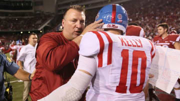 Oct 15, 2016; Fayetteville, AR, USA; Arkansas Razorbacks head coach Bret Bielema talks to Ole Miss Rebels quarterback Chad Kelly (10) after the game at Donald W. Reynolds Razorback Stadium. Arkansas defeated Ole Miss 34-30. Mandatory Credit: Nelson Chenault-USA TODAY Sports