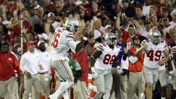 Sep 17, 2016; Norman, OK, USA; Ohio State Buckeyes quarterback J.T. Barrett (16) celebrates throwing a touchdown pass during the first half against the Oklahoma Sooners at Gaylord Family - Oklahoma Memorial Stadium. Mandatory Credit: Kevin Jairaj-USA TODAY Sports