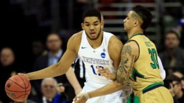 Mar 28, 2015; Cleveland, OH, USA; Kentucky Wildcats forward Karl-Anthony Towns (12) is guarded by Notre Dame Fighting Irish forward Zach Auguste (30) during the first half in the finals of the midwest regional of the 2015 NCAA Tournament at Quicken Loans Arena. Mandatory Credit: Andrew Weber-USA TODAY Sports