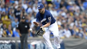 MILWAUKEE, WI - OCTOBER 04: Mike Moustakas #18 of the Milwaukee Brewers fields a ground ball during Game One of the National League Division Series against the Colorado Rockies at Miller Park on October 4, 2018 in Milwaukee, Wisconsin. (Photo by Stacy Revere/Getty Images)