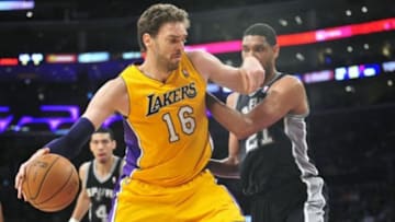 March 19, 2014; Los Angeles, CA, USA; Los Angeles Lakers center Pau Gasol (16) moves to the basket against the San Antonio Spurs during the first half at Staples Center. Mandatory Credit: Gary A. Vasquez-USA TODAY Sports