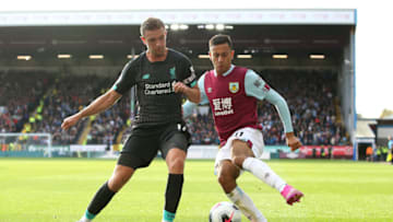 BURNLEY, ENGLAND - AUGUST 31: Jordan Henderson of Liverpool battles for possession with Dwight McNeil of Burnley during the Premier League match between Burnley FC and Liverpool FC at Turf Moor on August 31, 2019 in Burnley, United Kingdom. (Photo by Jan Kruger/Getty Images)