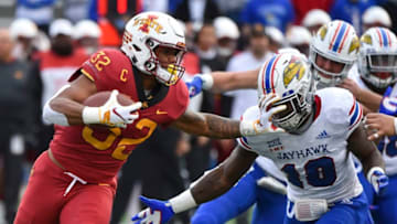 LAWRENCE, KS - NOVERMBER 3: Running back David Montgomery #32 of the Iowa State Cyclones stiff arms cornerback Julian Chandler #10 of the Kansas Jayhawks as he rushes in the first quarter at Memorial Stadium on November 3, 2018 in Lawrence, Kansas. (Photo by Ed Zurga/Getty Images)