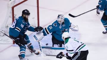 Jan 16, 2016; San Jose, CA, USA; San Jose Sharks goalie Martin Jones (31) defends the shot by Dallas Stars left wing Patrick Sharp (10) with Sharks defenseman Brent Burns (88) during the third period at SAP Center at San Jose. San Jose defeated Dallas 4-3. Mandatory Credit: Kelley L Cox-USA TODAY Sports