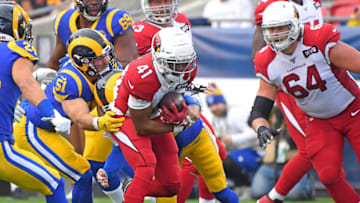 LOS ANGELES, CA - DECEMBER 29: Running back Kenyan Drake #41 of the Arizona Cardinals carries the ball before he is stopped by linebacker Troy Reeder #51 of the Los Angeles Rams in the first quarter of the game at the Los Angeles Memorial Coliseum on December 29, 2019 in Los Angeles, California. (Photo by Jayne Kamin-Oncea/Getty Images)