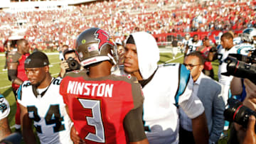TAMPA, FL - JANUARY 1: Quarterback Jameis Winston #3 of the Tampa Bay Buccaneers speaks with quarterback Cam Newton #1 of the Carolina Panthers following the Buccaneers' 17-16 win over the Panthers at an NFL game on January 1, 2017 at Raymond James Stadium in Tampa, Florida. (Photo by Brian Blanco/Getty Images)