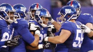 Aug 9, 2014; East Rutherford, USA; New York Giants running back Rashad Jennings (23) celebrates with teammates after scoring a touchdown against the Pittsburgh Steelers during the preseason game at MetLife Stadium. Mandatory Credit: William Perlman/THE STAR-LEDGER via USA TODAY Sports