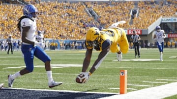 MORGANTOWN, WV - OCTOBER 06: Jovani Haskins #84 of the West Virginia Mountaineers dives into the end zone for a 14-yard touchdown after catching a pass against the Kansas Jayhawks in the second quarter of the game at Mountaineer Field on October 6, 2018 in Morgantown, West Virginia. (Photo by Joe Robbins/Getty Images)