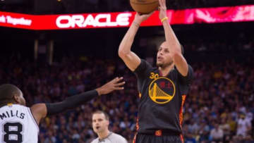 February 20, 2015; Oakland, CA, USA; Golden State Warriors guard Stephen Curry (30) shoots the basketball against San Antonio Spurs guard Patty Mills (8) during the first quarter at Oracle Arena. Mandatory Credit: Kyle Terada-USA TODAY Sports
