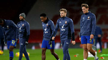 LONDON, ENGLAND - DECEMBER 16: Kyle Walker-Peters, Stuart Armstrong and Jannik Vestergaard of Southampton warm up prior to the Premier League match between Arsenal and Southampton at Emirates Stadium on December 16, 2020 in London, England. The match will be played without fans, behind closed doors as a Covid-19 precaution. (Photo by Adrian Dennis - Pool/Getty Images)