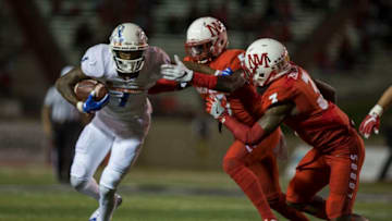 ALBUQUERQUE, NM - OCTOBER 7: Wide receiver Cedrick Wilson #1 of the Boise State Broncos avoids a tackle from the New Mexico Lobos at Branch Field on October 7, 2016 in Albuquerque, New Mexico. The Boise State Broncos beat the New Mexico Lobos 49-21. (Photo by Adria Malcolm/Getty Images)
