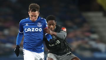 LIVERPOOL, ENGLAND - JANUARY 24: Bernard of Everton battles for possession with Osaze Urhoghide of Sheffield Wednesday during the Emirates FA Cup Fourth Round match between Everton and Sheffield Wednesday at Goodison Park on January 24, 2021 in Liverpool, England. Sporting stadiums around the UK remain under strict restrictions due to the Coronavirus Pandemic as Government social distancing laws prohibit fans inside venues resulting in games being played behind closed doors. (Photo by Clive Brunskill/Getty Images)