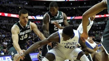 Nov 12, 2013; Chicago, IL, USA; Kentucky Wildcats forward Julius Randle (30) and Michigan State Spartans forward Gavin Schilling (34) go for a loose ball during the first half at the United Center. Mandatory Credit: David Banks-USA TODAY Sports